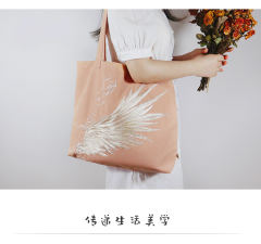 应龙创意绣花帆布包-资料图