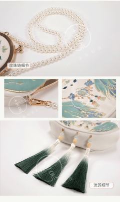 雀舞山林·绣花包-资料图